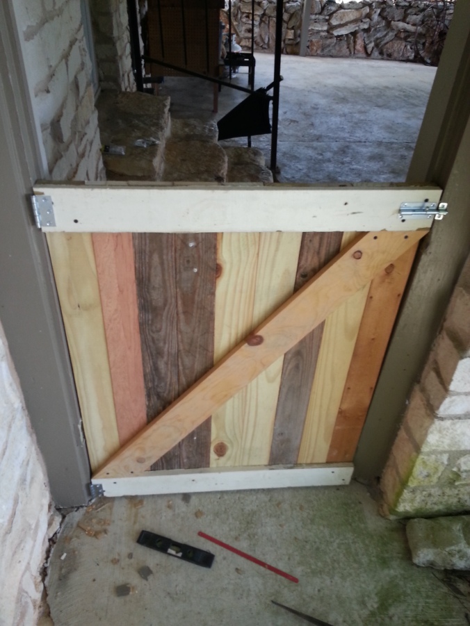 Since it was a custom build I had to chisel out two new recesses for the hinges to rest in. Used wedges and a level to get the door plumb and, well, level.